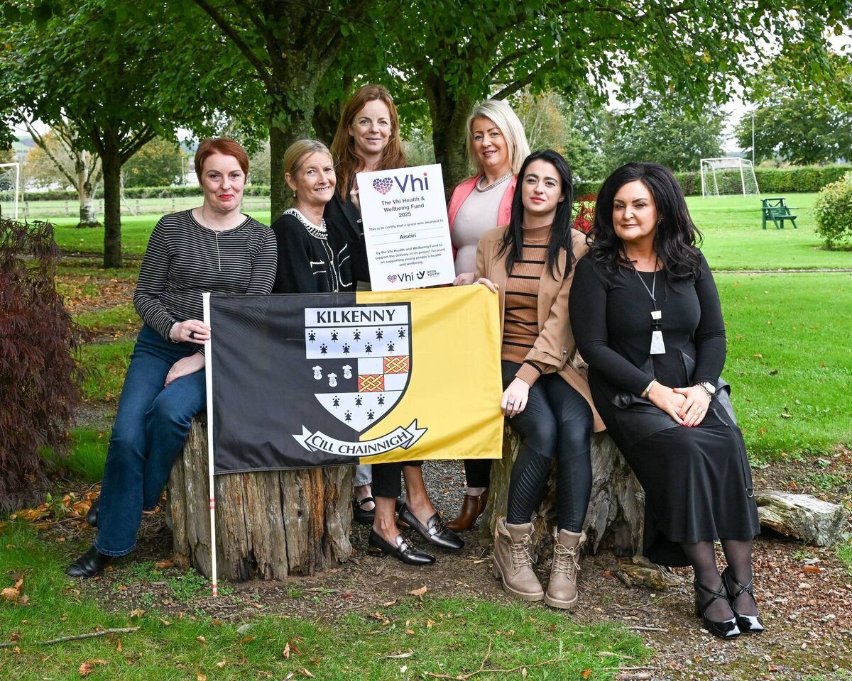 Youth workers and support staff from Aiséirí pictured with Therese Bourke, head of customer care, Vhi.