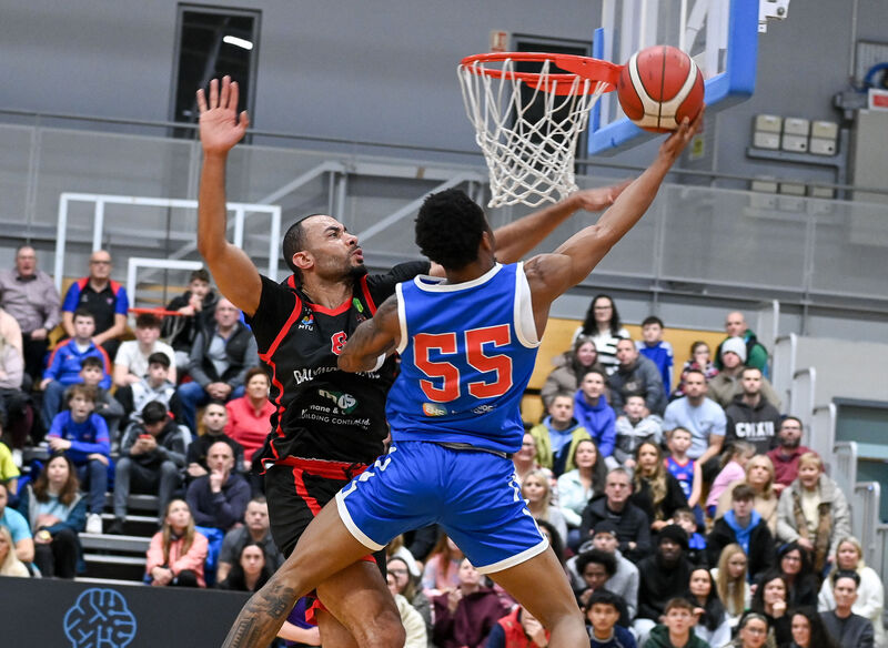  UCC Demons' Shariff Black looks for the hoop under pressure from Ballincollig's Joshua Steel. Picture: David Keane.