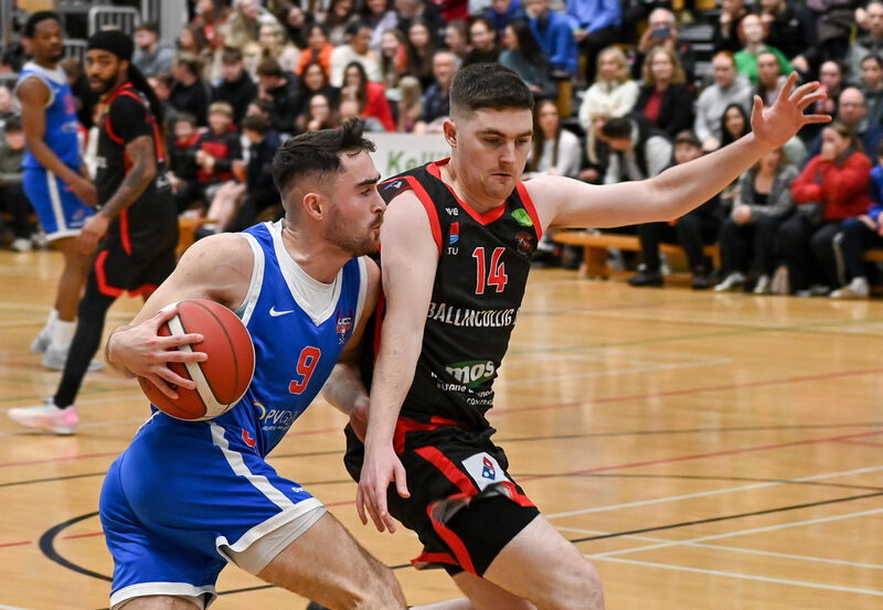  UCC Demons' James Hannigan has his progress halted by Ballincollig's Luke O'Sullivan. Picture: David Keane.