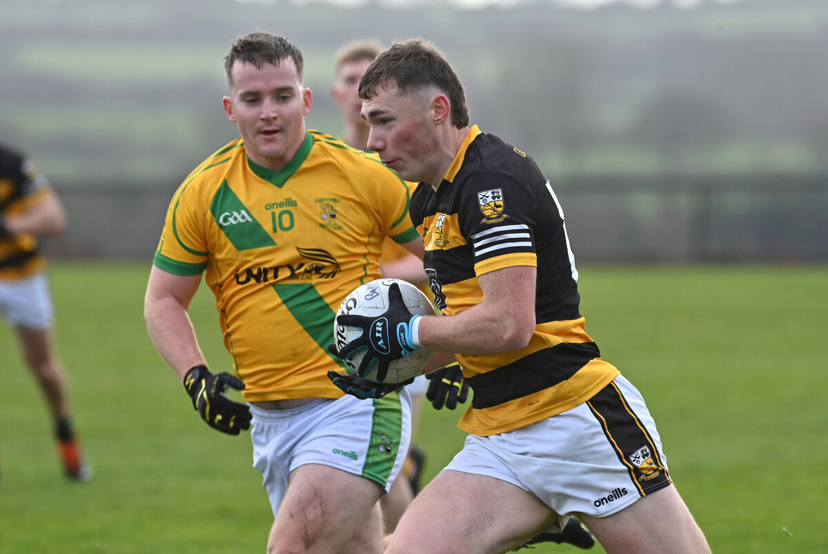  Mark Lenahan, Buttevant, races past Pádraig Harnett, Ahane. Picture: Dan Linehan