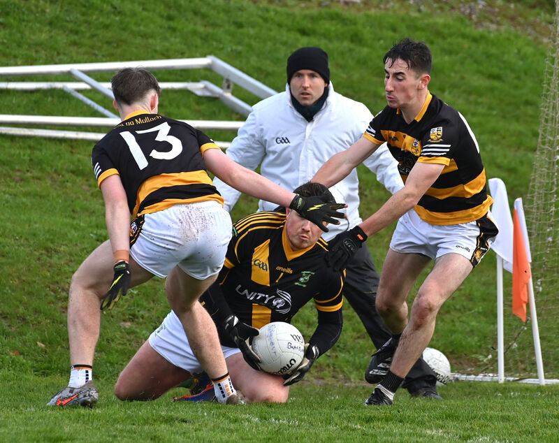 Buttevant players David Hanlon and Aaron Trimm putting pressure on Ahane keeper Tristan O'Sullivan. Picture: Dan Linehan Buttevant players David Hanlon and Aaron Trimm putting pressure on Ahane keeper Tristan O'Sullivan. Picture: Dan Linehan
