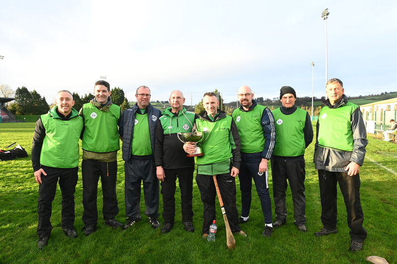  Ballincollig management team Garrett Flynn, Éamonn Murphy, Finbarr Kelly, Noel Hurley, Dave Collins, Kevin Downey, Frank Daly and Eamonn Keating with the cup. Picture: Larry Cummins