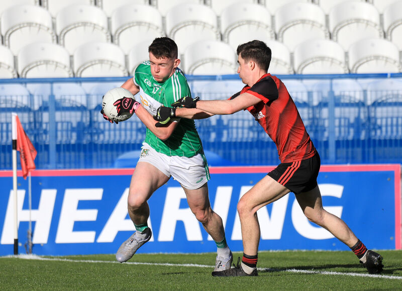 Aghabullogue's Matthew Bradley tries to get past Askeaton's Niall Barry. Picture: David Creedon
