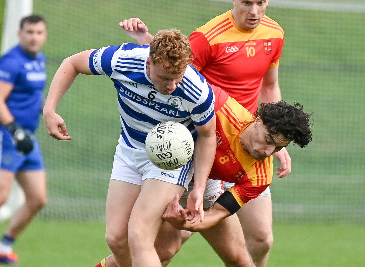  Castlehaven's Robbie Minihane and Mallow's Shane Merritt tussle for possession, during their Premier SFC clash at Ovens. Picture: David Keane.