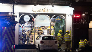 Car smashes into front of busy Dublin city centre convenience store