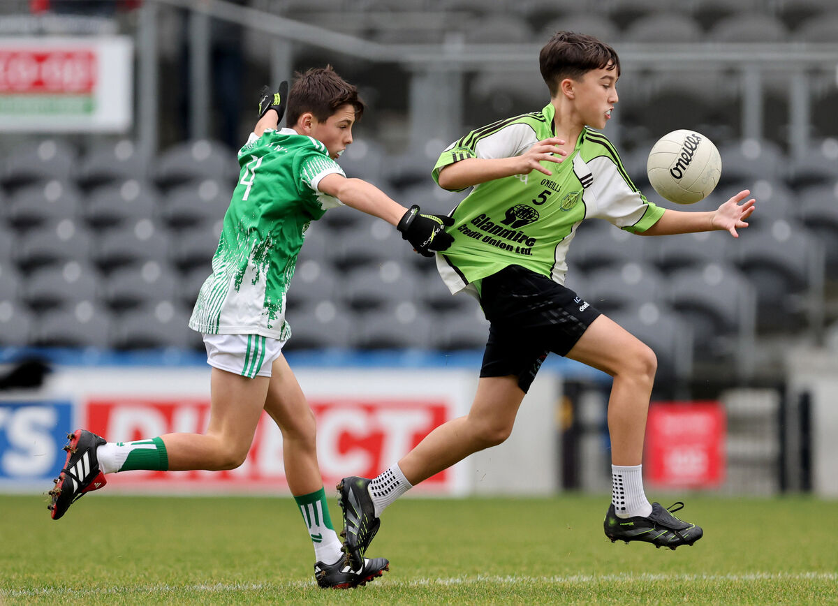 Isaac Collins, Upper Glanmire, is tackled by Jack Cronin, Clonpriest. Picture: Jim Coughlan.