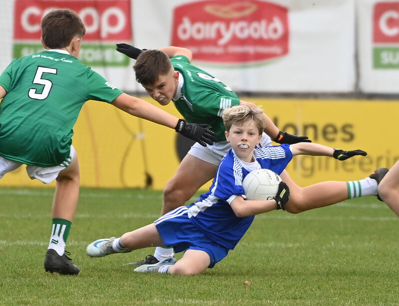 Scartleigh’s Sam McCarthy is tackled by Scoil Mhuire na nGrást, Belgooly’s Matthew McGowan. Picture: Eddie O’Hare Scartleigh’s Sam McCarthy is tackled by Scoil Mhuire na nGrást, Belgooly’s Matthew McGowan. Picture: Eddie O’Hare