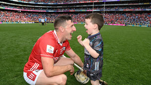 <p>Cork's Patrick Horgan celebrates with his son Jack after defeating Dublin in the All-Ireland SHC semi-final at Croke Park in July. Picture: Eddie O'Hare</p>