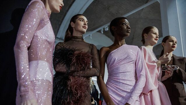 <p>Models backstage in sequins and feathers at Ukrainian Fashion Week. Picture:Alamy/PA </p>