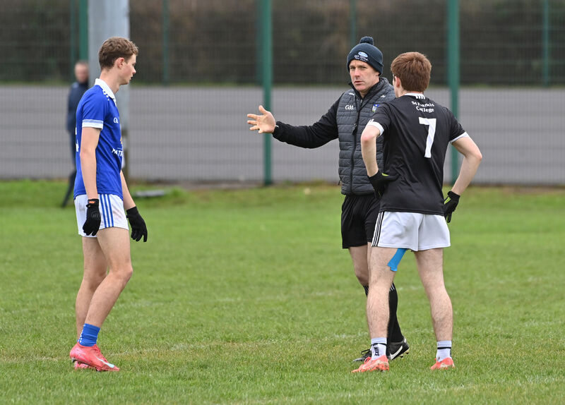  Captain of St Francis College, Rochestown Evam Cummins with St Flannan's College, Ennis Captain Danny Lyne and referee Johnny Murphy prior to their Corn Uí Mhuirí Group 1 match at the Mick Neville Park, Rathkeale. Picture Dan Linehan