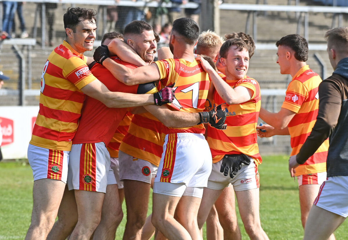Newcestown goalkeeper Christopher White celebrates with teammates after the penalty shootout against Carrigaline. Picture: Eddie O'Hare