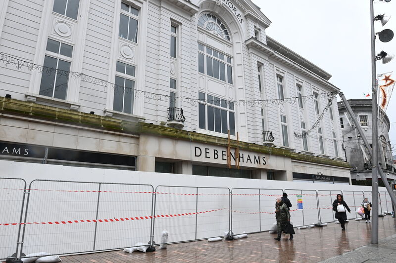 Wooden hoarding was erected at the front exterior of the former Debenhams/ Roches Stores building on St Patrick Street, Cork City. Pic: Larry Cummins 