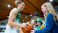 Edel Thornton signs a basketball at full time 15/11/2025