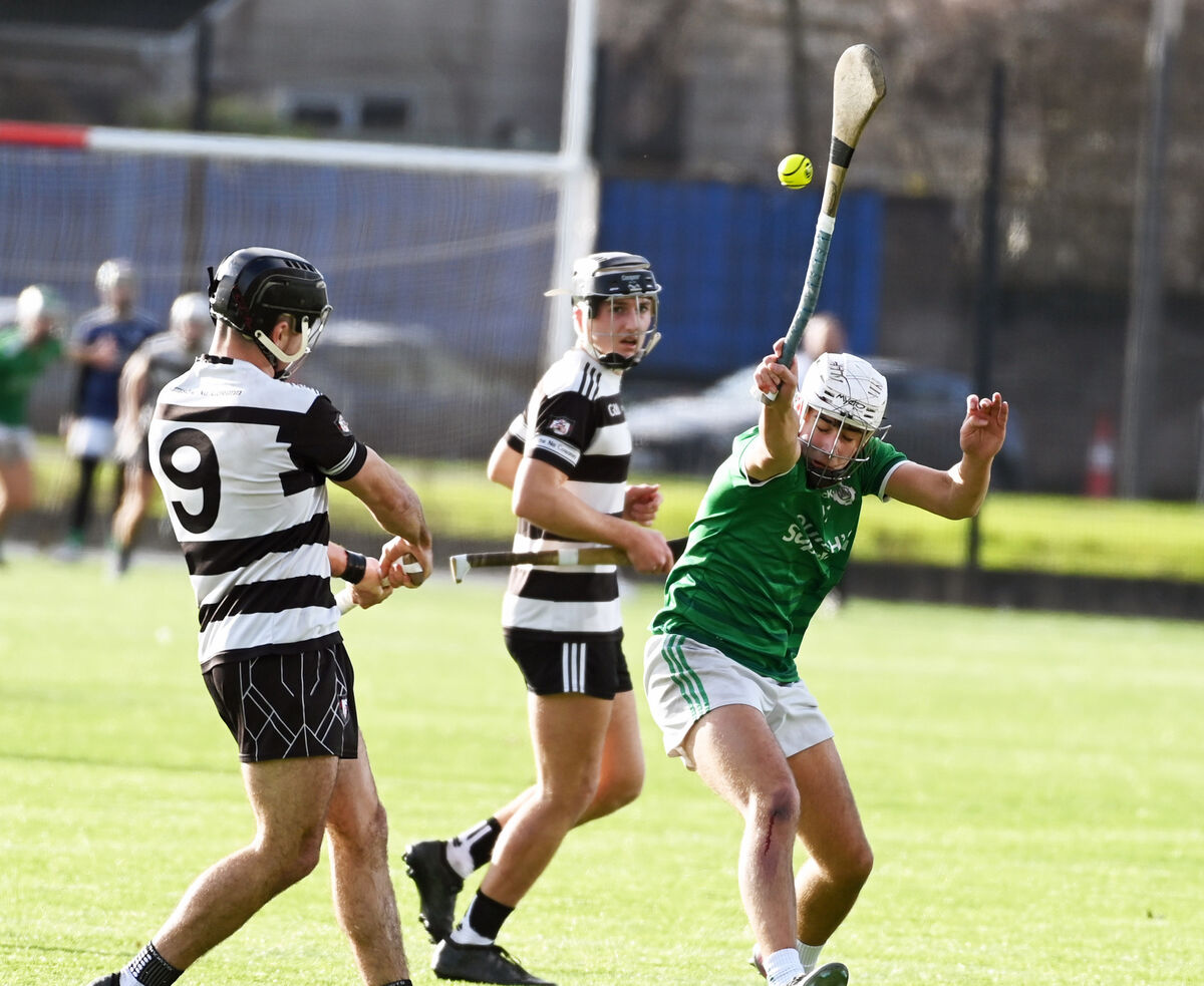 Midleton's Mikey Finn has his shot blocked down by Ballincollig's Cian O'Connor. Picture: Eddie O'Hare