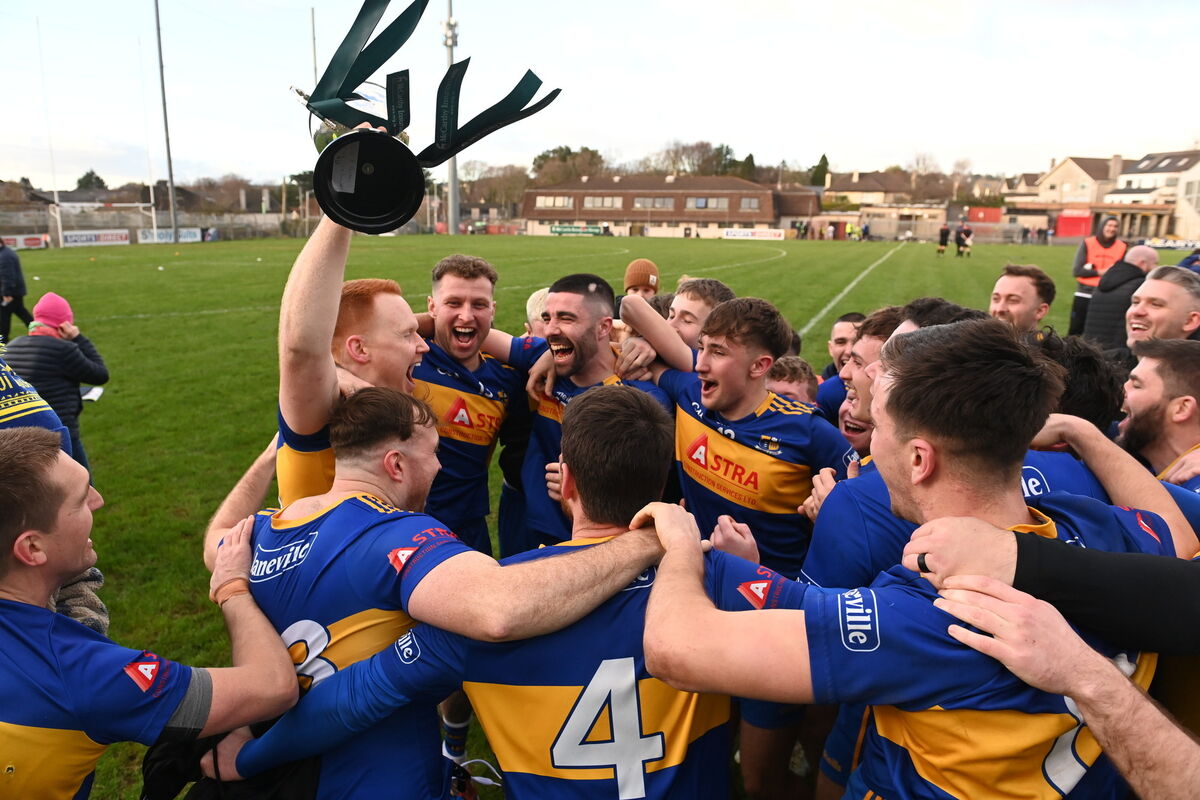  Vice-captain Cormac Nolan lifts the cup as Carrigaline celebrate. Picture: Larry Cummins
