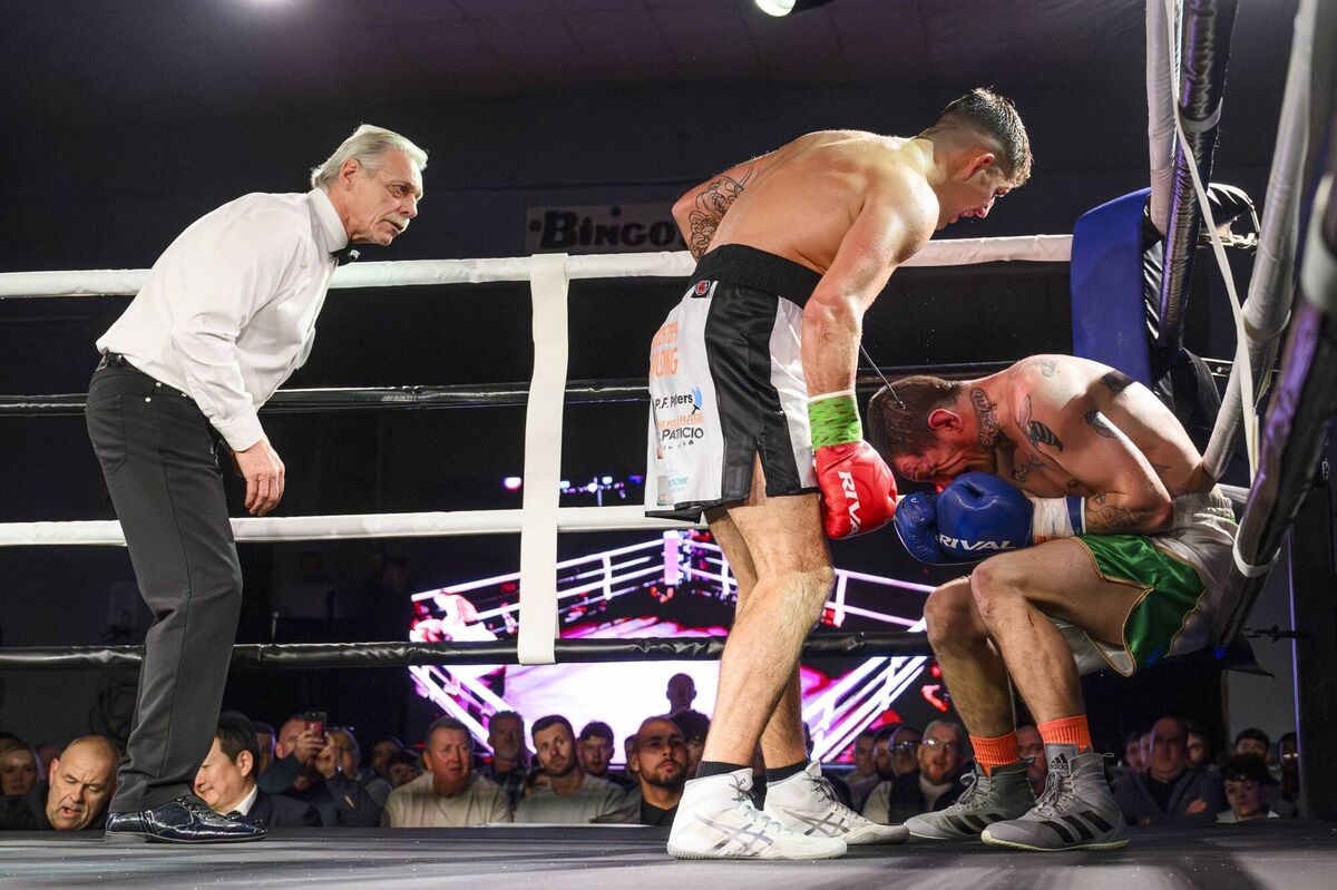 Corks Brian ‘BB’ Long has his opponent William O’Reilly of Manchester hurt during their bout on the Nowhere2Hyde Revolution pro boxing card held at the Parochial Hall, Cork on Saturday November 29th. Picture: Doug Minihane 