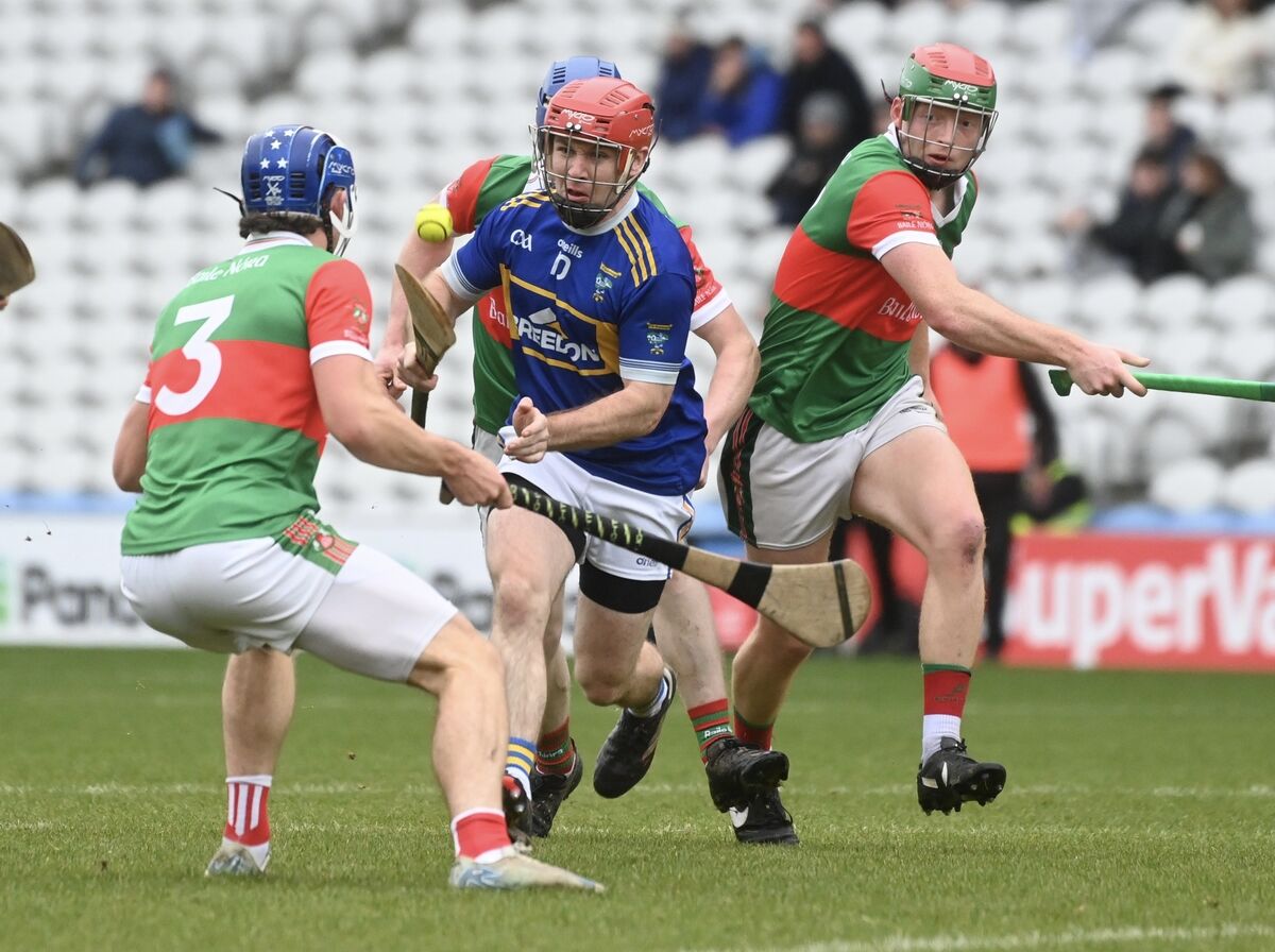  Paddy Walsh, Kilshannig is tackled by Neil Lordan, Ballinora. Picture: Larry Cummins