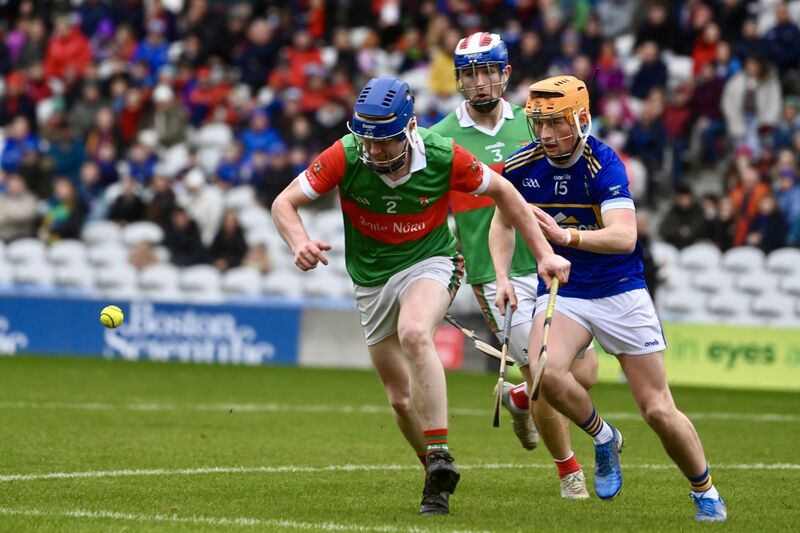 Tim Forde, Ballinora races for the ball ahead of Ryan Crowley, Kilshannig. Picture: Larry Cummins Tim Forde, Ballinora races for the ball ahead of Ryan Crowley, Kilshannig. Picture: Larry Cummins