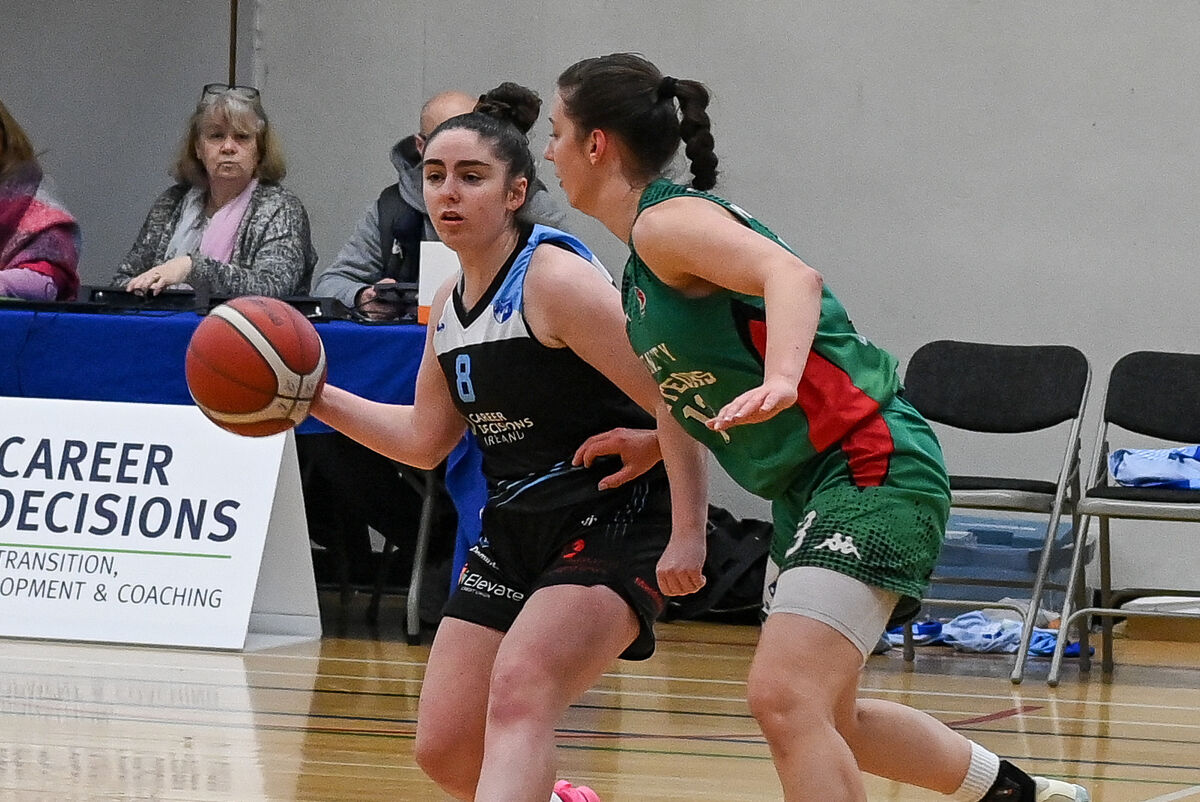  UCC Glanmire's Annaliese Murphy gets her pass away as Trinity Meteors' Franciska Treiliha closes in during their Women's Super League clash at the Mardyke Arena.