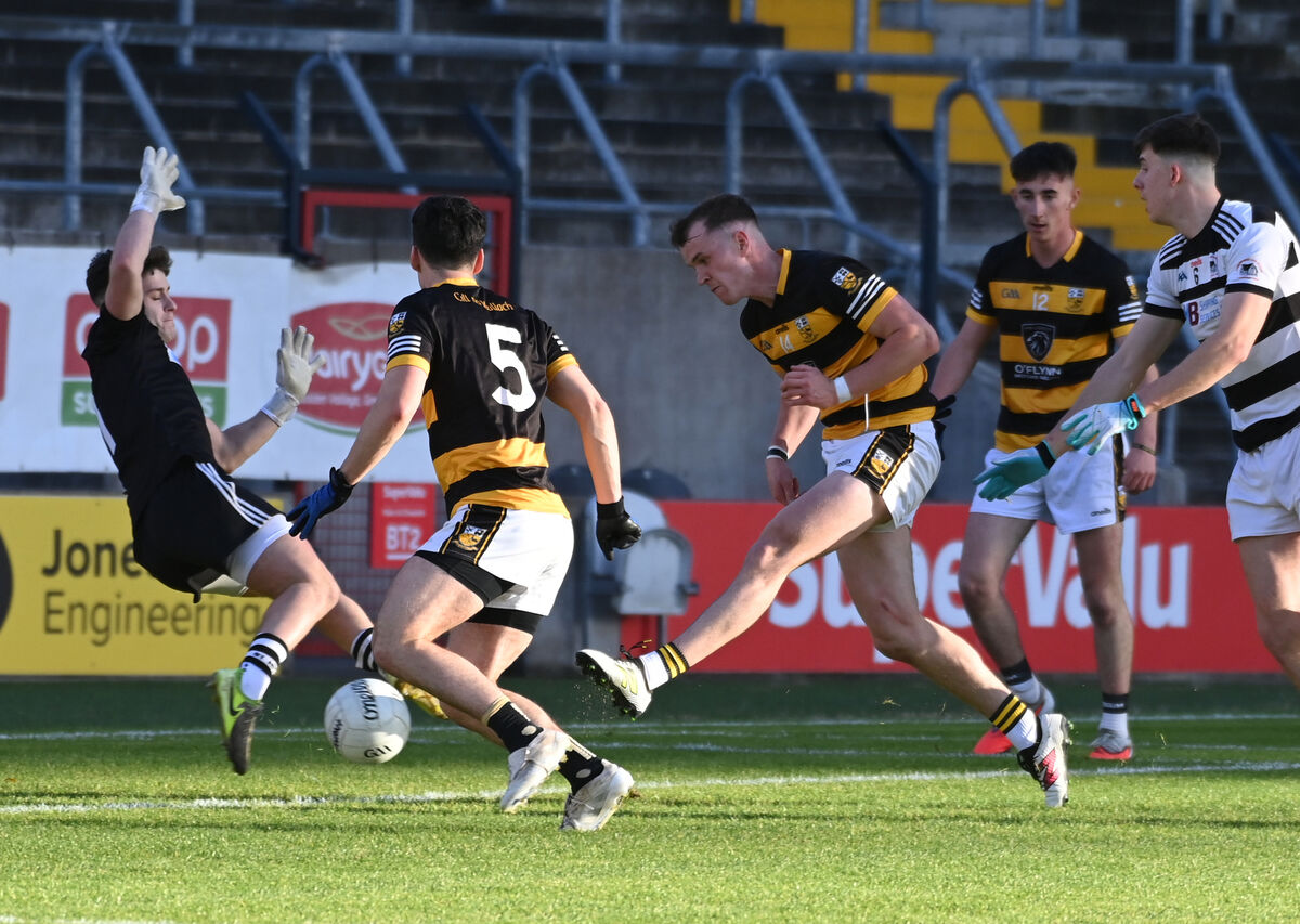 Buttevant's Michael O'Neill slots the ball past St. Nick's goalkeeper Ross Cronin to score the opening goal during the McCarthy Insurance Group Premier JFC final. Picture: Eddie O'Hare