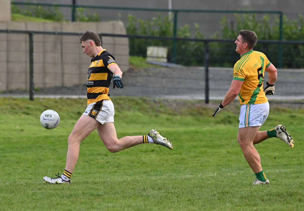  Mark Lenahan, Buttevant, about to strike for his goal, watched by Ian Keatley, Ahane, in the AIB Munster Club Junior Football Championship semi-final at Kildorrery. Picture: Dan Linehan
