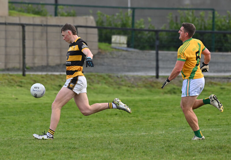  Mark Lenahan, Buttevant, about to strike for his goal, watched by Ian Keatley, Ahane, in the AIB Munster Club Junior Football Championship semi-final at Kildorrery. Picture: Dan Linehan