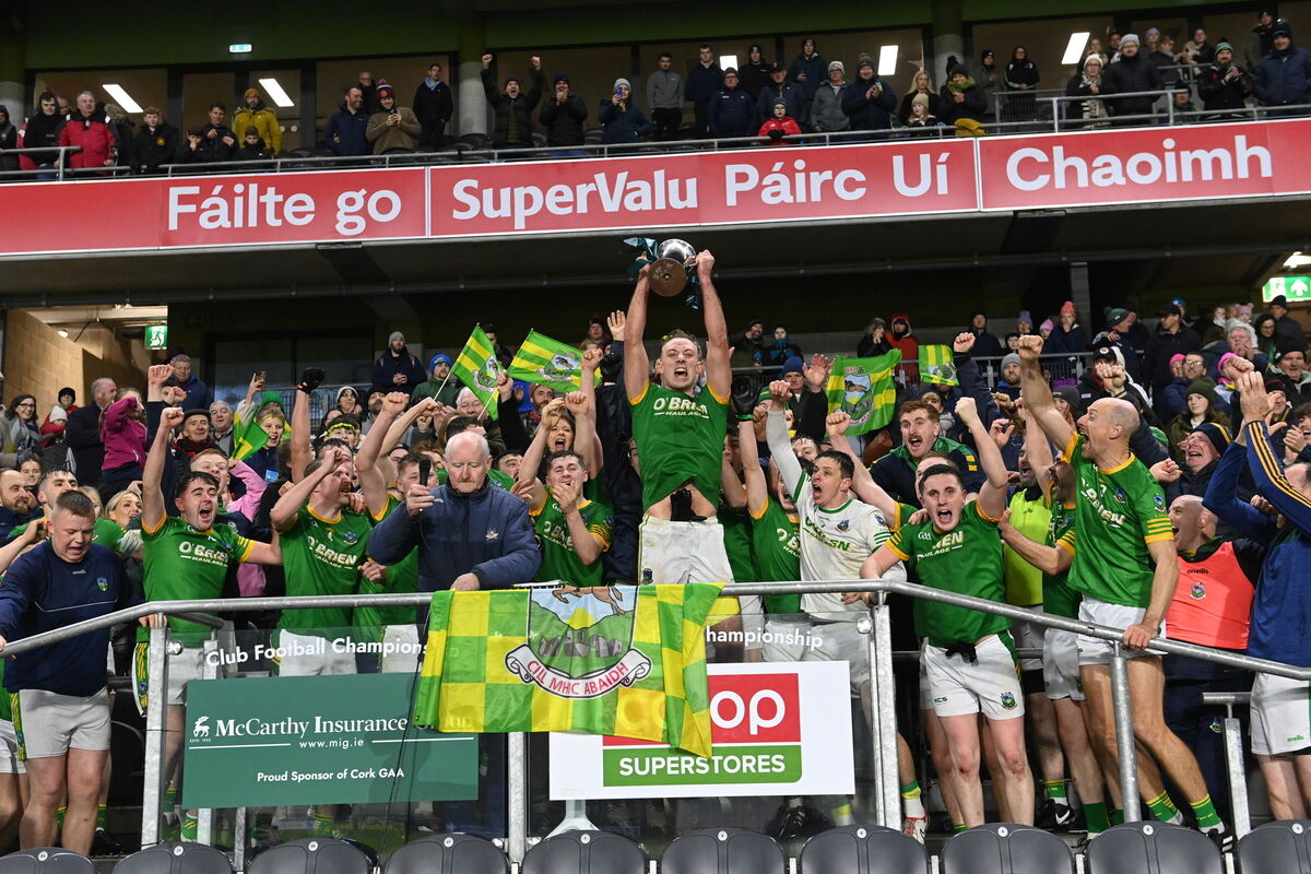  Kilmacabea captain Ian Jennings lifts the cup as the team celebrates after the county win against Donoughmore. Picture: Larry Cummins