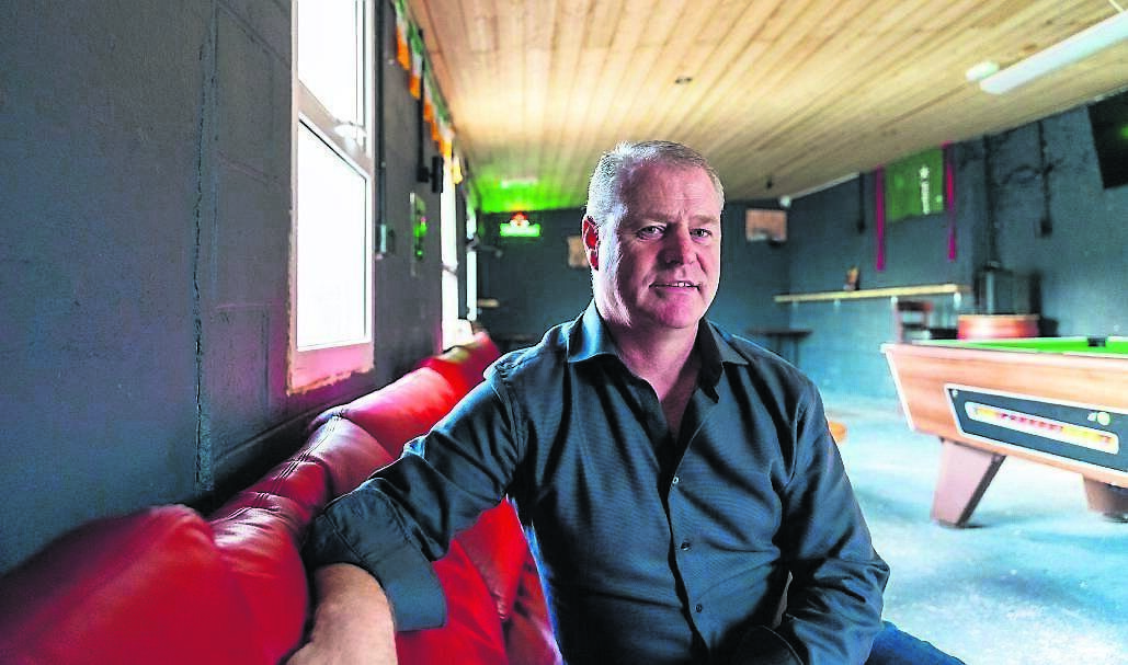 Pat O’Riordan in the roofed area he renovated as a pool area and back-bar. 