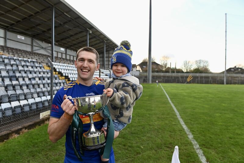  Full-back Peter Ronayne with his two-year-old son Rian holding the cup. Picture: Larry Cummins