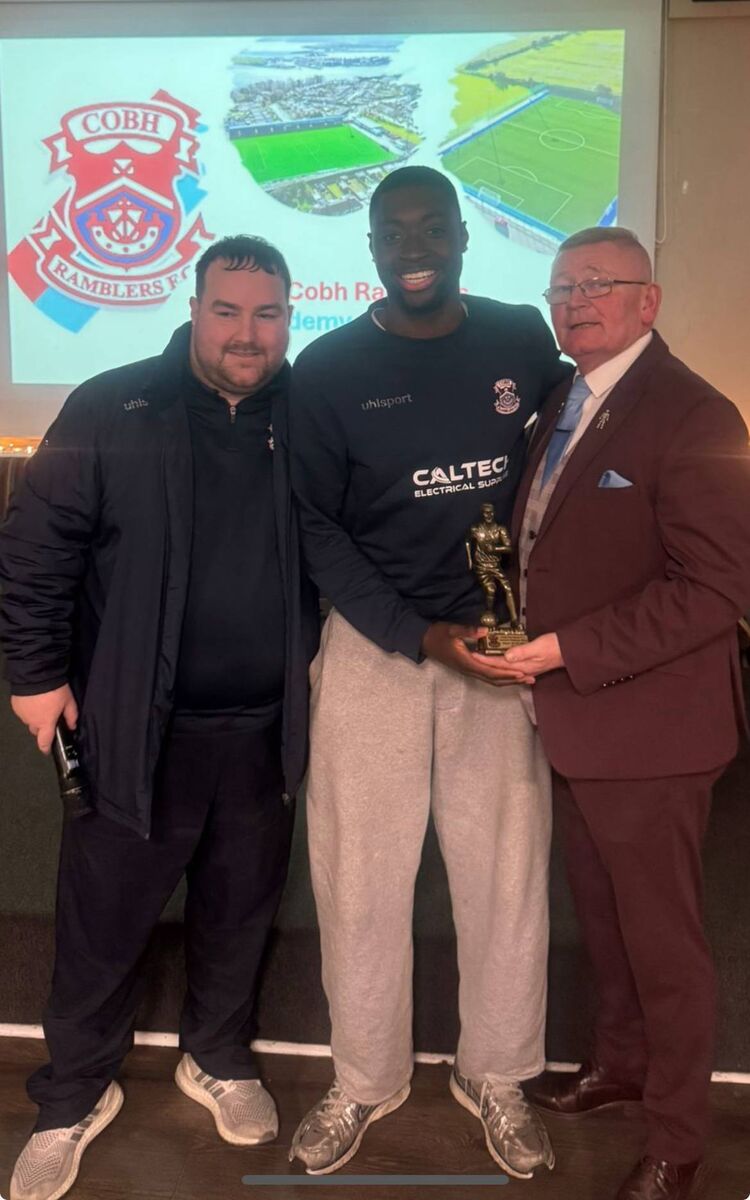 Alan Geasley and Bob Donovan present Faruq Adsgboyega with his Overall Cobh Ramblers Academy Player of the Year award.