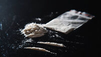 Hard drugs on black table. Close up.