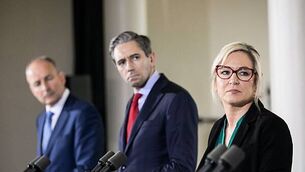 ‘Pantomime’ erupts in Dáil as Simon Harris holds up graphic of Michelle O’Neill