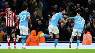 Man City close gap on leaders Arsenal with one-sided win over Sunderland
