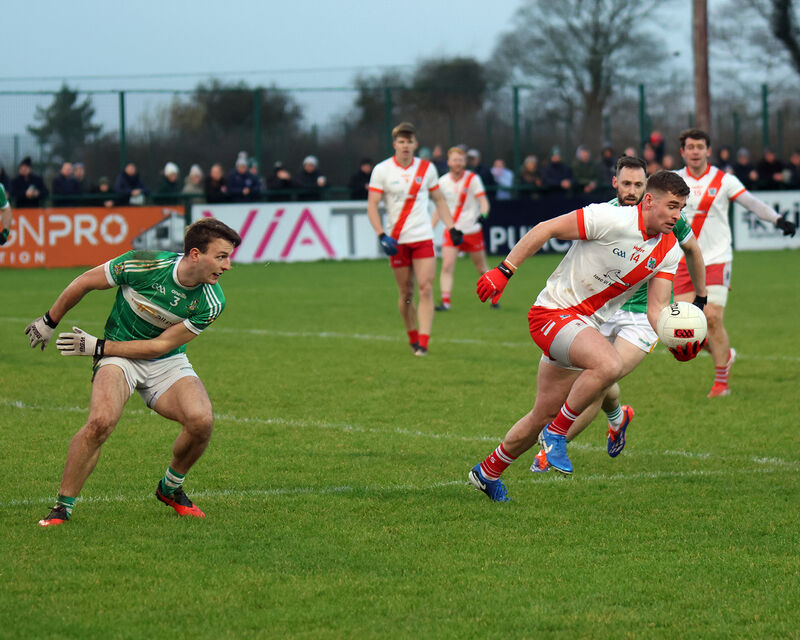 Conor Smyth on the left in action for Aghabullogue. Picture: Brendan Gleeson