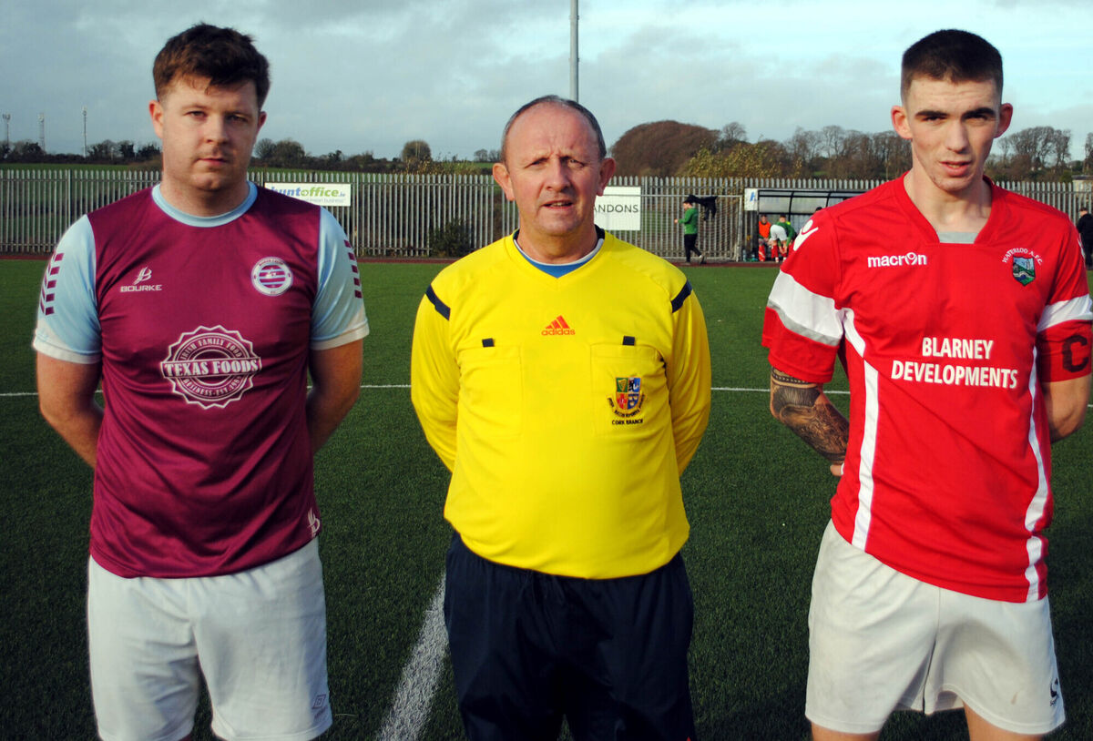 Waterloo's captain Jack Homan (right), with Boher Celtic's Conor O'Riordan, accompanied by referee Paul Bowdren.