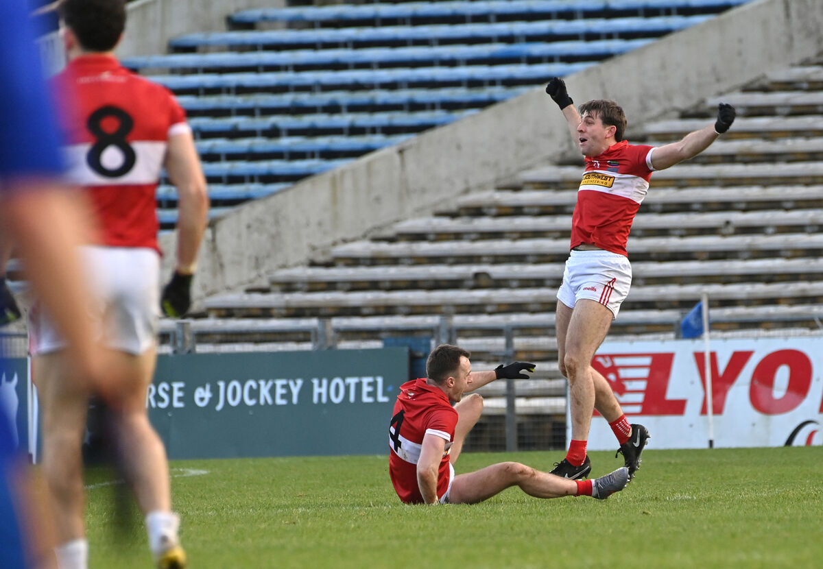  Dingle's Tom O'Sullivan with Conor Geaney who celebrates after scoring from a two-point free in added time against St Finbarr's. Picture: Dan Linehan