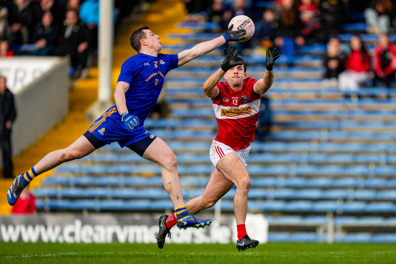 Alan O'Connor of St Finbarr's gets a hand to the ball ahead of Conor Geaney of Dingle. Picture: INPHO/James Lawlor Alan O'Connor of St Finbarr's gets a hand to the ball ahead of Conor Geaney of Dingle. Picture: INPHO/James Lawlor