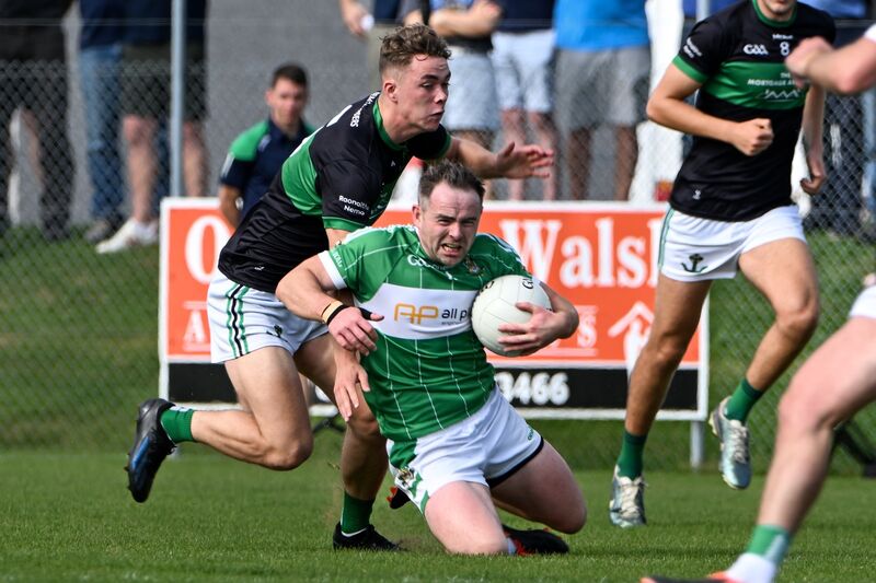 Aghabullogue captain John Corkery is brought to his knees by a strong challenge from Nemo Rangers' Conor Moore this year. Picture: Chani Anderson Aghabullogue captain John Corkery is brought to his knees by a strong challenge from Nemo Rangers' Conor Moore this year. Picture: Chani Anderson