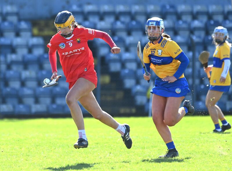 Cork's Aoife Healy racing away from Clare's Aoife Andersen during the Very Division One camogie league. The dual star will be a huge loss to both Cork sides for the coming season. Picture: Eddie O'Hare