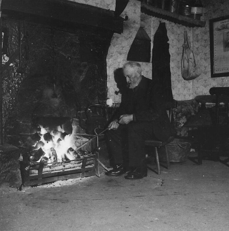 A man stokes his fire in a typical Irish cottage in 1949. A reader today recalls his mother making the foundation for the fire each day in the winter. (Photo by Ron Bell/Fox Photos/Getty Images) A man stokes his fire in a typical Irish cottage in 1949. A reader today recalls his mother making the foundation for the fire each day in the winter. (Photo by Ron Bell/Fox Photos/Getty Images)