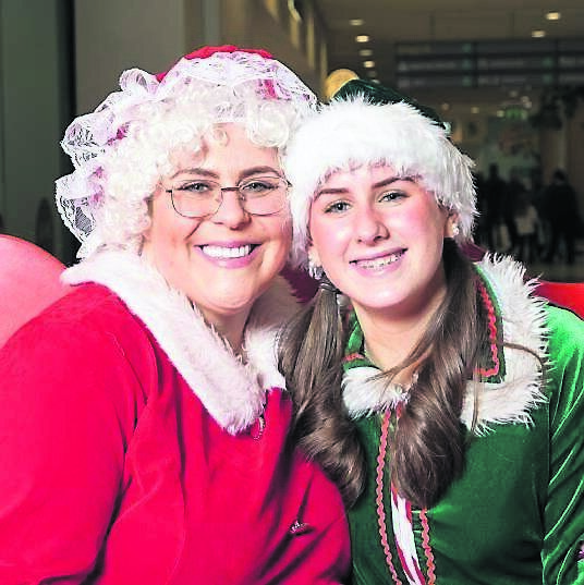 Mrs Claus (Niamh Kelleher) with head elf Jingle (Emily McCormack) in Mahon Point. Mrs Claus (Niamh Kelleher) with head elf Jingle (Emily McCormack) in Mahon Point.