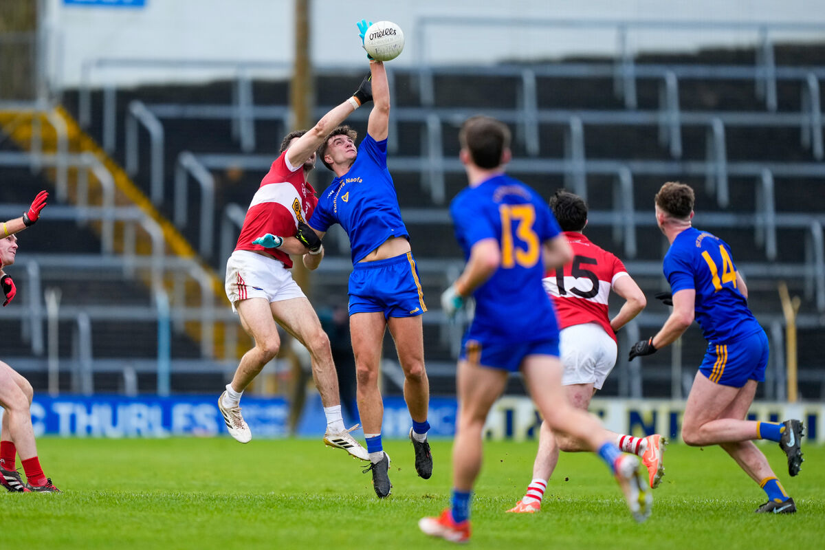 Brian Hayes of St Finbarr's competes with Mark O'Connor of Dingle for the dropping ball. Picture: INPHO/James Lawlor