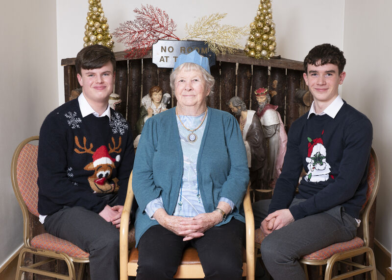 Peter Meaney and James O'Regan from Presentation Brothers College with Kay Bass, Share resident, originally from South Africa. 