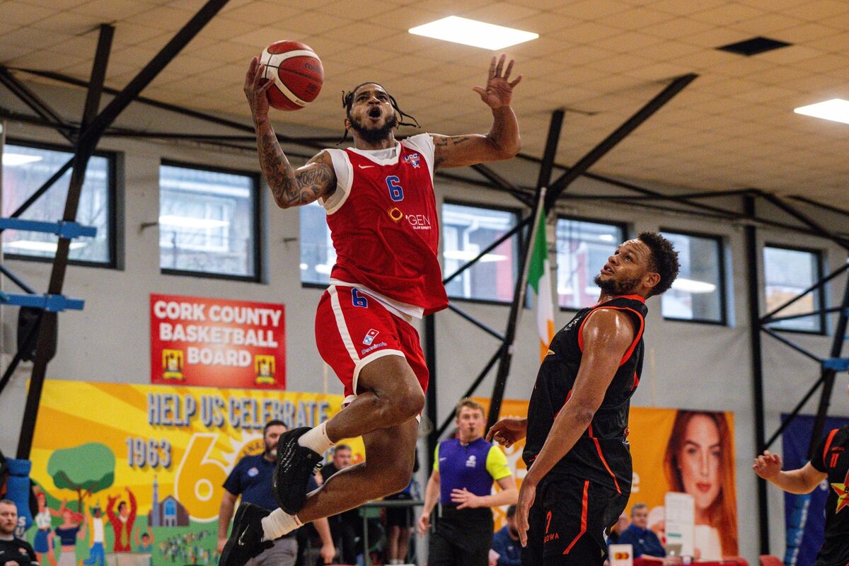 Jordan Washington of the UCC Demons leaps to dunk against Sligo. Picture: Chani Anderson