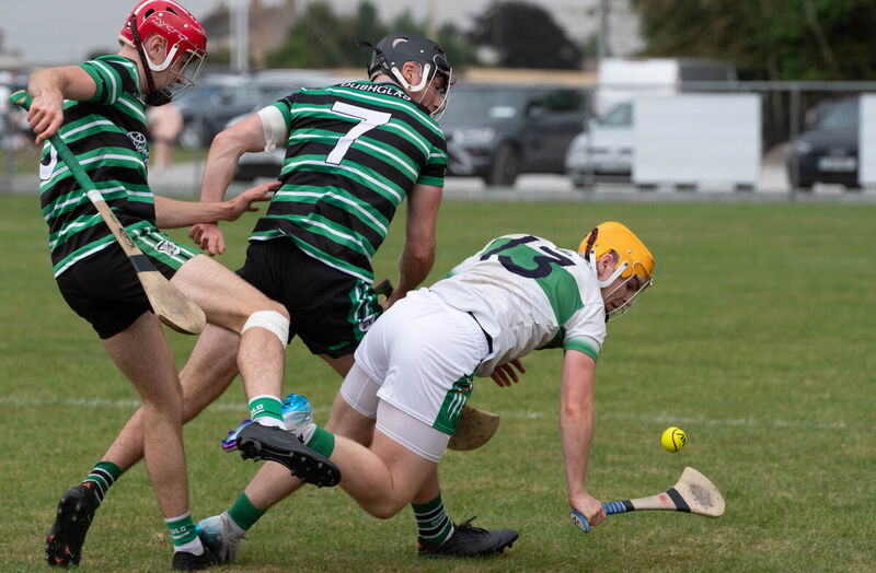 Kanturk's Rory Sheahan is challenged by Mark Howell and James O'Callaghan Maher of Douglas. Picture: Howard Crowdy