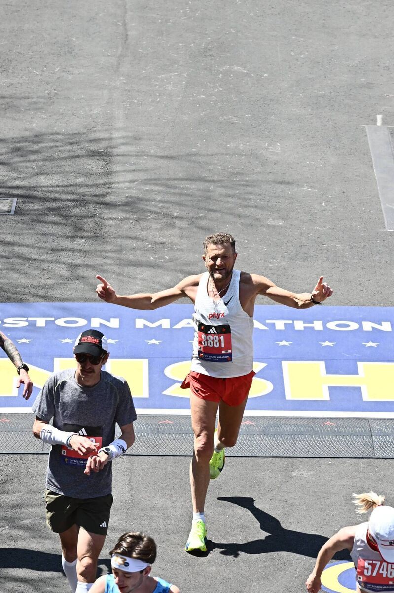 Liam Cotter crossing the finish line at the Boston Marathon. Liam Cotter crossing the finish line at the Boston Marathon.
