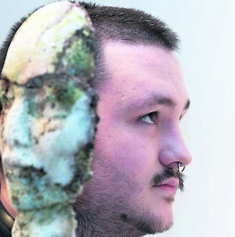 Calvin Hayes from Togher with his piece titled ‘degradation’ on show at Bringing the Light Exhibition at MTU. Picture: Darragh Kane
Calvin Hayes from Togher with his piece titled ‘degradation’ on show at Bringing the Light Exhibition at MTU. Picture: Darragh Kane