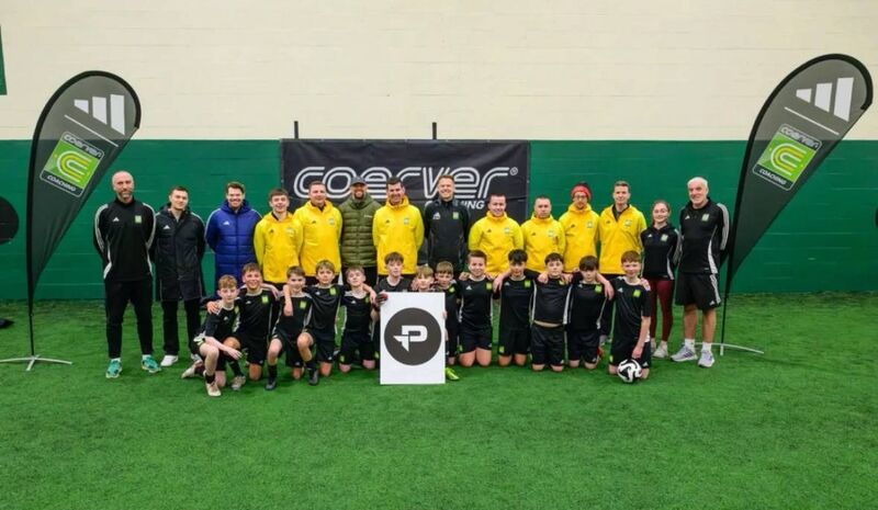 The Coerver management team and coaches including Luke Noonan with some young children at a recent training session.