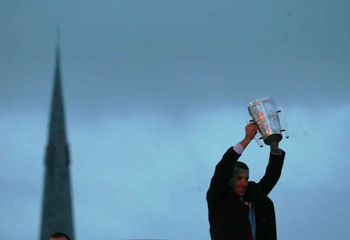 Ben O'Connor, the captain of Cork, holds the Liam MacCarthy Cup aloft at the homecoming for the victorious 2004 team. Picture: Inpho/Morgan Treacy