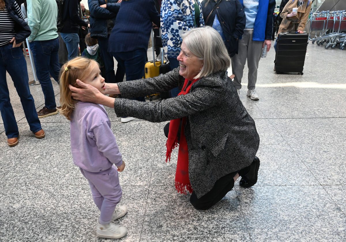  Grandmother Patricia Lenihan greeting her grandchild Erin who was returning from London with her parents Muiris and Pippa, and baby sister Florence. Arrivals at Cork Airport for Christmas 2025. Picture: Larry Cummins